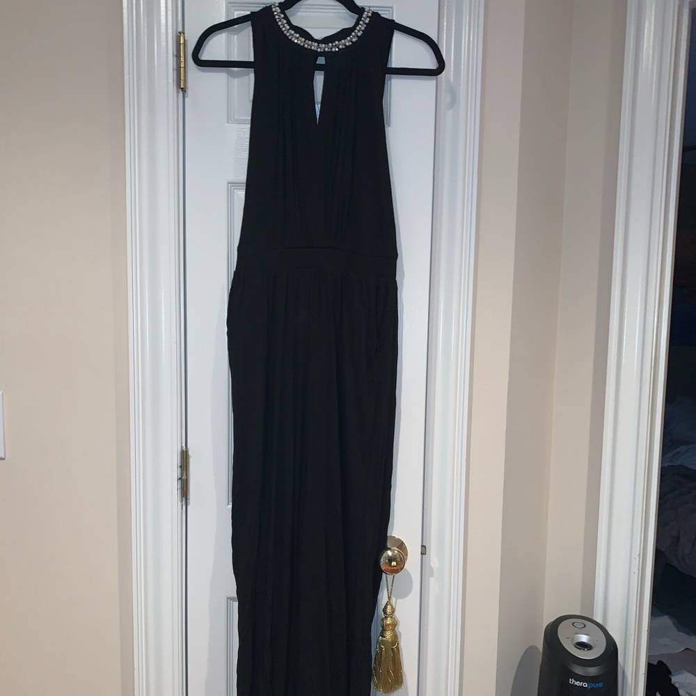 Black jumpsuit with pearl detail around neck